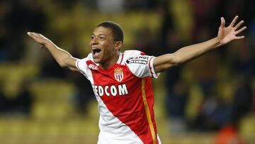 Monaco's French forward Kylian Mbappe Lottin celebrates after scoring a goal during the French L1 football match Monaco (ASM) vs Troyes (ESTAC) on February 20, 2016 at the "Louis II Stadium" in Monaco. AFP PHOTO / VALERY HACHE
