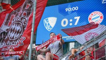 Bayern Munich's fans celebratethe end of the German first division Bundesliga football match VfL Bochum v FC Bayern Munich in Bochum, western Germany, on August 21, 2022. - DFL REGULATIONS PROHIBIT ANY USE OF PHOTOGRAPHS AS IMAGE SEQUENCES AND/OR QUASI-VIDEO (Photo by SASCHA SCHUERMANN / AFP) / DFL REGULATIONS PROHIBIT ANY USE OF PHOTOGRAPHS AS IMAGE SEQUENCES AND/OR QUASI-VIDEO (Photo by SASCHA SCHUERMANN/AFP via Getty Images)