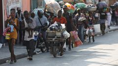 People flee their homes as police confront armed gangs after prominent gang leader Jimmy Cherizier called for Haiti's Prime Minister Ariel Henry's government to be toppled, in Port-au-Prince, Haiti, February 29, 2024. REUTERS/Ralph Tedy Erol