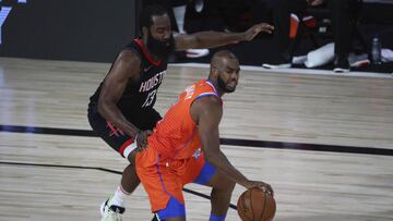 Oklahoma City Thunder guard Chris Paul (3) controls the ball against Houston Rockets guard James Harden (13) in the second half of Game 1 of an NBA basketball first-round playoff series, Tuesday, Aug. 18, 2020, in Lake Buena Vista, Fla. (Kim Klement/Pool Photo via AP)