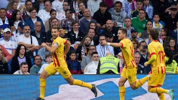 A Girona penalty for an Asensio handball gave the visitors a draw at the Bernabéu after Vinicius got the opener. Kroos sent off.