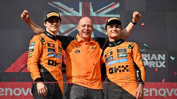 Winner McLaren's British driver Lando Norris (L), second placed McLaren's Australian driver Oscar Piastri (R) and McLaren's Head of Design Mark Ingham (C) celebrate on the podium after winning the Formula One Hungarian Grand Prix at the Hungaroring circuit in Mogyorod near Budapest, Hungary, on August 3, 2025. (Photo by Attila KISBENEDEK / AFP)