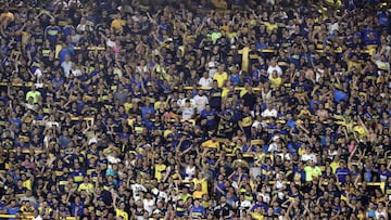 Boca Juniors' supporters cheer for their team during the Argentina First Division Superliga Tournament football match against Argentinos Juniors at La Bombonera stadium, in Buenos Aires, on November 30, 2019. (Photo by ALEJANDRO PAGNI / AFP)
