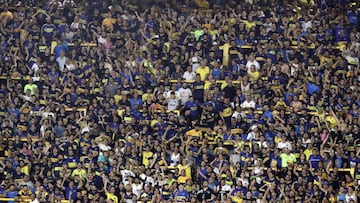 Boca Juniors&#039; supporters cheer for their team during the Argentina First Division Superliga Tournament football match against Argentinos Juniors at La Bombonera stadium, in Buenos Aires, on November 30, 2019. (Photo by ALEJANDRO PAGNI / AFP)