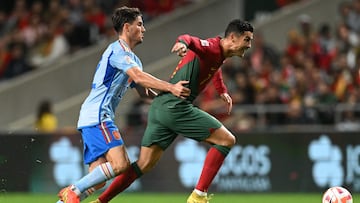 (FILES) In this file photo taken on September 27, 2022, Portugal's forward Cristiano Ronaldo is foold by Spain's defender Hugo Guillamon (L) during the UEFA Nations League, league A, group 2 football match between Portugal and Spain, at the Municipal Stadium in Braga. (Photo by PATRICIA DE MELO MOREIRA / AFP)