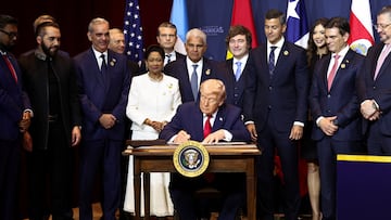 U.S. President Donald Trump signs the "Commitment to countering cartel criminal activity" document during the "Shield of the Americas" Summit in Miami, Florida, U.S., March 7, 2026. REUTERS/Kevin Lamarque