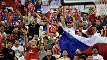Czech Republic fans hold their national flag as they cheer during the Basketball World Cup Group E game between Japan and Czech Republic in Shanghai on September 3, 2019. (Photo by HECTOR RETAMAL / AFP)