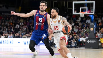 AS Monaco's American guard #55 Mike James drives the ball against Barcelona's Czech guard #13 Tomas Satoransky during the Euroleague basketball match between FC Barcelona and AS Monaco at the Palau Blaugrana arena in Barcelona, on March 1, 2024. (Photo by Josep LAGO / AFP)