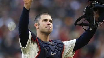 FILE - In this Sunday, Sept. 30, 2018, file photo, Minnesota Twins' Joe Mauer acknowledges a standing ovation as he donned catcher's gear and caught for one pitch against a Chicago White Sox batter in the ninth inning of a baseball game in Minneapolis. Mauer began his career as a catcher before switching to first base. The Minneapolis Star Tribune reports that Mauer has taken out an ad in its Sunday, Nov. 11, 2018, paper to announce his retirement. (AP Photo/Jim Mone, File)