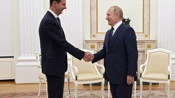 Russian President Vladimir Putin shakes hands with Syrian President Bashar al-Assad during a meeting at the Kremlin in Moscow, Russia, September 13, 2021.