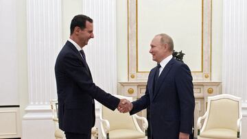 Russian President Vladimir Putin shakes hands with Syrian President Bashar al-Assad during a meeting at the Kremlin in Moscow, Russia, September 13, 2021.