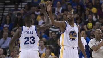 October 4, 2016; Oakland, CA, USA; Golden State Warriors forward Kevin Durant (35) celebrates with forward Draymond Green (23) against the Los Angeles Clippers during the second quarter at Oracle Arena. Mandatory Credit: Kyle Terada-USA TODAY Sports