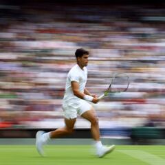 Why do players have to wear white clothing when playing at Wimbledon?