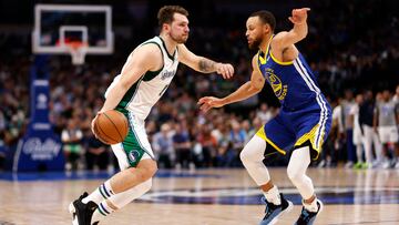 The Dallas Mavericks' Luka Doncic and the Golden State Warriors' Steph Curry in action.