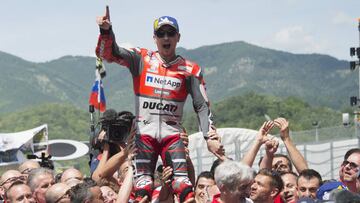 SCARPERIA, ITALY - JUNE 03: Jorge Lorenzo of Spain and Ducati Team celebrates the victory with team under the podium at the end of the MotoGP race during the MotoGp of Italy - Race at Mugello Circuit on June 3, 2018 in Scarperia, Italy. (Photo by Mirco