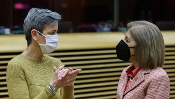 European Union Commission Executive Vice-President Margrethe Vestager (L) speaks with Commissioner for Health and Food Safety Stella Kyriakides during a meeting of the College of European Commissioners in Brussels on January 26, 2022. (Photo by YVES HERMA