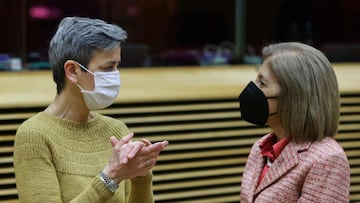 European Union Commission Executive Vice-President Margrethe Vestager (L) speaks with Commissioner for Health and Food Safety Stella Kyriakides during a meeting of the College of European Commissioners in Brussels on January 26, 2022. (Photo by YVES HERMA