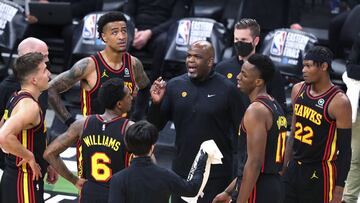 Atlanta Hawks interim coach Nate McMillan talks with Bogdan Bogdanovic, John Collins, Lou Williams, Onyeka Okongwu and Cam Reddish, from left, during a timeout in the third quarter against the Milwaukee Bucks in Game 5 of the Eastern Conference finals in the NBA basketball playoffs Thursday, July 1, 2021, in Milwaukee. (Curtis Compton/Atlanta Journal-Constitution via AP)