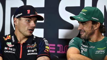 Aston Martin�s Spanish driver Fernando Alonso (R) chats with Red Bull Racing�s Dutch driver Max Verstappen (L) as they take part in a press conference ahead of the Singapore Formula One Grand Prix night race at the Marina Bay Street Circuit in Singapore on September 14, 2023. (Photo by Lillian SUWANRUMPHA / AFP)