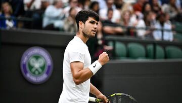 Spain's Carlos Alcaraz celebrates winning a point against USA's Tommy Paul during their men's singles quarter-finals tennis match on the ninth day of the 2024 Wimbledon Championships at The All England Lawn Tennis and Croquet Club in Wimbledon, southwest London, on July 9, 2024. (Photo by Ben Stansall / AFP) / RESTRICTED TO EDITORIAL USE