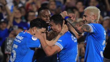 Cruz Azul's Uruguayan midfielder #15 Ignacio Rivero (L) celebrates after scoring with teammates during the CONCACAF Champions Cup final football match between Mexico's Cruz Azul and Canada's Vancouver Whitecaps at the Olimpico Universitario Stadium in Mexico City on June 1, 2025. (Photo by Victor Cruz / AFP)