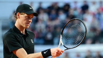 Italy's Jannik Sinner reacts as he plays against Argentina's Mariano Navone during their men's singles match of the ATP Rome Open tennis tournament at Foro Italico in Rome on May 10, 2025. (Photo by Marco BERTORELLO / AFP)