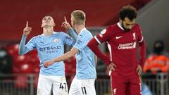 07 February 2021, United Kingdom, Liverpool: Manchester City&#039;s Phil Foden (L) celebrates scoring his side&#039;s fourth goal during the English Premier League soccer match between Liverpool and Manchester City at Anfield. Photo: Tim Keeton/PA Wire/dp