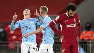 07 February 2021, United Kingdom, Liverpool: Manchester City's Phil Foden (L) celebrates scoring his side's fourth goal during the English Premier League soccer match between Liverpool and Manchester City at Anfield. Photo: Tim Keeton/PA Wire/dp