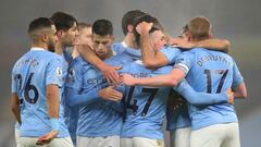 MANCHESTER, ENGLAND - JANUARY 13: Phil Foden of Manchester City celebrates with teammates Joao Cancelo, Rodrigo and Kevin De Bruyne after scoring their team&#039;s first goal during the Premier League match between Manchester City and Brighton &amp; Hove 