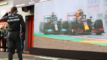 Mercedes&#039; British driver Lewis Hamilton looks at a replay of the race after the Emilia Romagna Formula One Grand Prix at the Autodromo Internazionale Enzo e Dino Ferrari race track in Imola, Italy, on April 18, 2021. (Photo by Bryn Lennon / POOL / AFP)