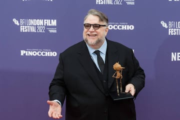 LONDON, UNITED KINGDOM - OCTOBER 15: Director Guillermo del Toro holds a figurine of Pinocchio as he attends the world premiere of 'Pinocchio' at the Royal Festival Hall during the 66th BFI London Film Festival in London, United Kingdom on October 15, 2022. (Photo by Wiktor Szymanowicz/Anadolu Agency via Getty Images)