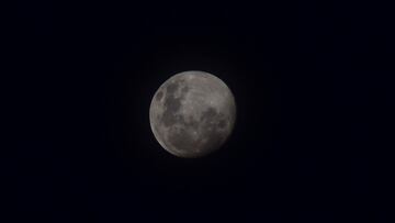 View of the super blood moon in Asuncion, on May 24, 2021. (Photo by NORBERTO DUARTE / AFP)