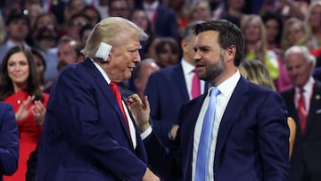 Republican presidential nominee and former U.S. President Donald Trump and Republican vice presidential nominee J.D. Vance shake hands during Day 1 of the Republican National Convention (RNC), at the Fiserv Forum in Milwaukee, Wisconsin, U.S., July 15, 2024. REUTERS/Andrew Kelly