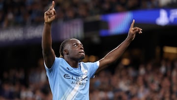 Manchester City's Belgian midfielder #11 Jeremy Doku celebrates after scoring his team's second goal during the UEFA Champions League league stage football match between Manchester City and Napoli at the Etihad Stadium in Manchester, north west England, on September 18, 2025. (Photo by Darren Staples / AFP)