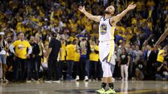 OAKLAND, CALIFORNIA - MAY 08: Stephen Curry #30 of the Golden State Warriors reacts after Klay Thompson #11 made the clinching basket with four second left of their game against the Houston Rockets during Game Five of the Western Conference Semifinals of 