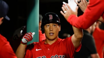 BOSTON, MA - JULY 26: Masataka Yoshida #7 of the Boston Red Sox is congratulated in the dugout after his sacrafice fly scored a runner during the fifth inning against the New York Yankees at Fenway Park on July 26, 2024 in Boston, Massachusetts. (Photo By Winslow Townson/Getty Images) (Photo by Winslow Townson / GETTY IMAGES NORTH AMERICA / Getty Images via AFP)