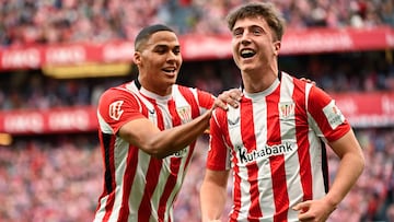 Athletic Bilbao's Spanish midfielder #23 Mikel Jauregizar Alboniga (R) celebrates scoring their first goal with teammate Athletic Bilbao's Spanish forward #21 Maroan Sannadi during the Spanish league football match between Athletic Club Bilbao and Real Valladolid FC at San Mames Stadium in Bilbao on February 23, 2025. (Photo by ANDER GILLENEA / AFP)