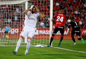 Karim Benzema reacts after hitting the bar