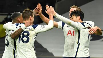 Tottenham Hotspur's English striker Harry Kane (2R) celebrates scoring his team's second goal with teammates during the English Premier League football match between Tottenham Hotspur and Arsenal at Tottenham Hotspur Stadium in London, on Decemb