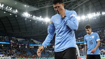 AL WAKRAH, QATAR - DECEMBER 02: Ronald Araujo of Uruguay shows dejection after the team fails to qualify for the knockout stage despite their 2-0 victory after the FIFA World Cup Qatar 2022 Group H match between Ghana and Uruguay at Al Janoub Stadium on December 02, 2022 in Al Wakrah, Qatar. (Photo by Maja Hitij - FIFA/FIFA via Getty Images)