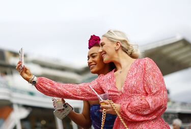 Racegoers attend the second day of the Grand National Festival horse race meeting at Aintree Racecourse in Liverpool, north-west England, on April 12, 2024. (Photo by Oli SCARFF / AFP)