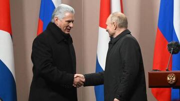 Cuban President Miguel Diaz-Canel Bermudez (L) and Russian President Vladimir Putin (R) shake hands during the inauguration of a monument to late Cuban leader Fidel Castro in Moscow on November 22, 2022. (Photo by Sergei GUNEYEV / SPUTNIK / AFP) (Photo by SERGEI GUNEYEV/SPUTNIK/AFP via Getty Images)