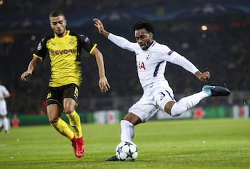 Dortmund's Jeremy Toljan challenges Danny Rose during the Group H clash of the Champions League in Germany.