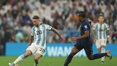 Argentina's midfielder #20 Alexis Mac Allister (L) fights for the ball with France's defender #05 Jules Kounde (R) during the Qatar 2022 World Cup final football match between Argentina and France at Lusail Stadium in Lusail, north of Doha on December 18, 2022. (Photo by Adrian DENNIS / AFP)