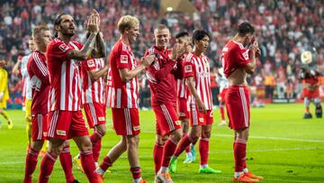 20 August 2022, Berlin: Soccer: Bundesliga, 1. FC Union Berlin - RB Leipzig, Matchday 3, An der Alten F?rsterei. Berlin's Christopher Trimmel (l-r), Morten Thorsby and Julian Ryerson thank the fans after the win. Photo: Andreas Gora/dpa - IMPORTANT NOTE: In accordance with the requirements of the DFL Deutsche Fu?ball Liga and the DFB Deutscher Fu?ball-Bund, it is prohibited to use or have used photographs taken in the stadium and/or of the match in the form of sequence pictures and/or video-like photo series. (Photo by Andreas Gora/picture alliance via Getty Images)