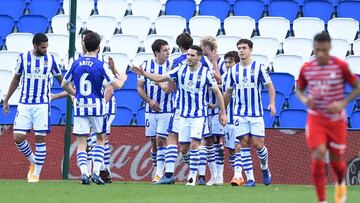 SAN SEBASTIAN, SPAIN - NOVEMBER 08: Mikel Oyarzabal of Real Sociedad celebrates with his team mates after scoring his sides second goal from the penalty spot during the La Liga Santander match between Real Sociedad and Granada CF at Estadio Anoeta on Nove