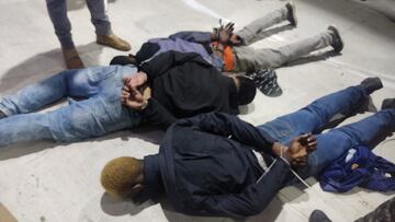 People accused of invading and taking over television station TC with weapons and forcing staff to lie and sit down, lie handcuffed on the floor in a police haundout, in Guayaquil, Ecuador, January 9, 2024. Ecuadorean Police/Handout via REUTERS  THIS IMAGE HAS BEEN SUPPLIED BY A THIRD PARTY. NO RESALES. NO ARCHIVES