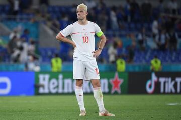 Switzerland's midfielder Granit Xhaka reacts to the defeat in the UEFA EURO 2020 Group A football match between Italy and Switzerland at the Olympic Stadium in Rome on June 16, 2021. (Photo by Ettore Ferrari / POOL / AFP)