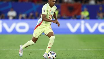 Spain's forward #19 Lamine Yamal runs with the ball during the UEFA Euro 2024 Group B football match between Albania and Spain at the Duesseldorf Arena in Duesseldorf on June 24, 2024. (Photo by KENZO TRIBOUILLARD / AFP)