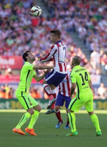 Busquets y Antoine Griezmann.